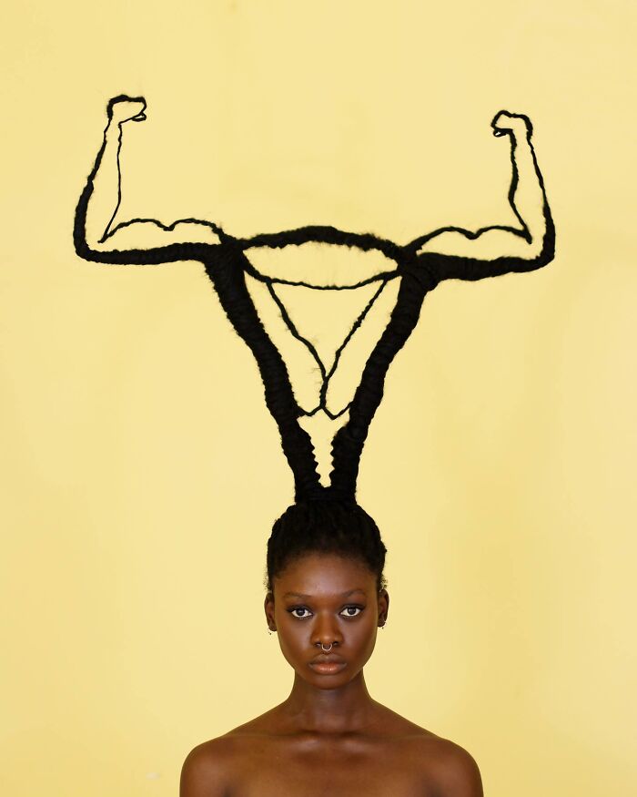 Hair sculpture of powerful muscular arms, flexing creativity.