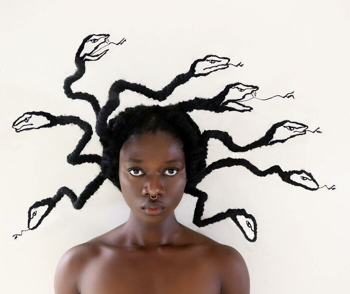 Artist's hair sculpture resembling snakes in a creative Medusa-style design.