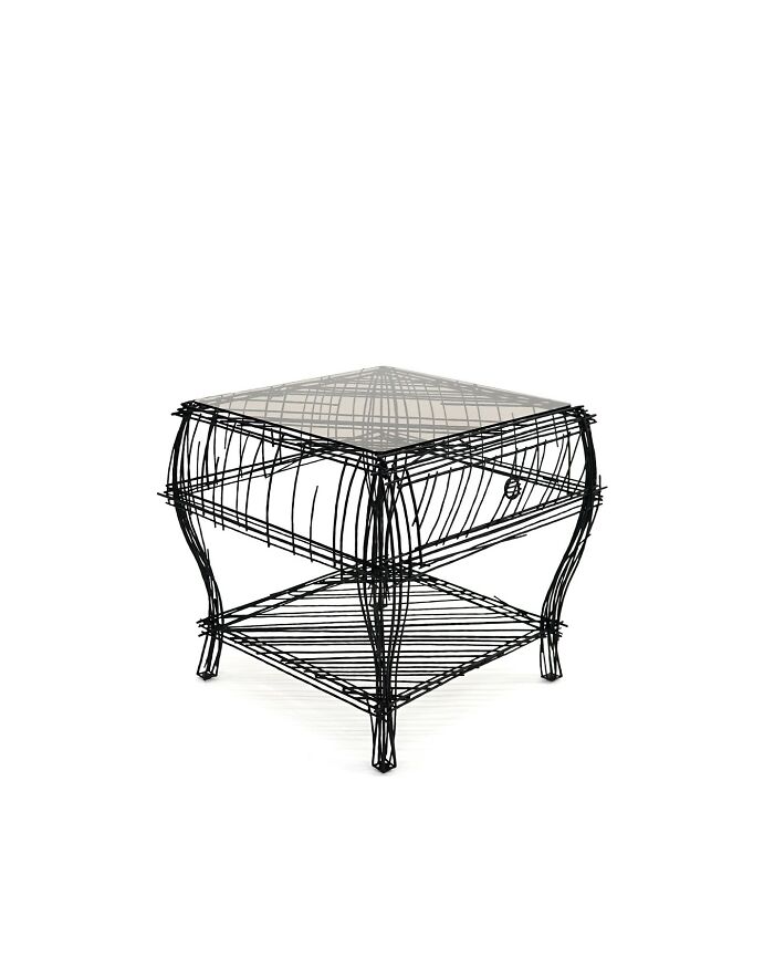 Wireframe furniture piece resembling a doodle sketch with a glass top, inspired by notebook-style design by Jinil Park.