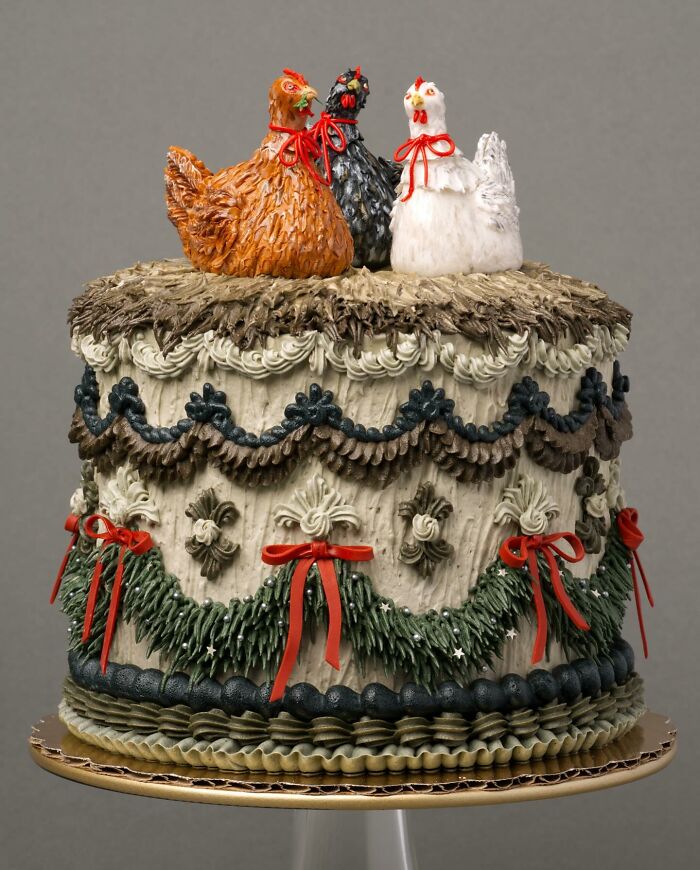 A creative vegan cake with charming chicken decorations and detailed icing.