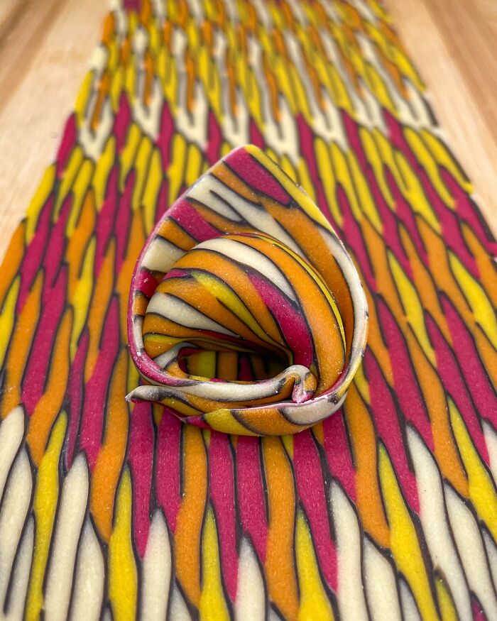 Colorful handcrafted pasta with intricate patterns, showcasing the artistry of a culinary chef. Colorful handcrafted pasta with intricate patterns, showcasing the artistry of a culinary chef.