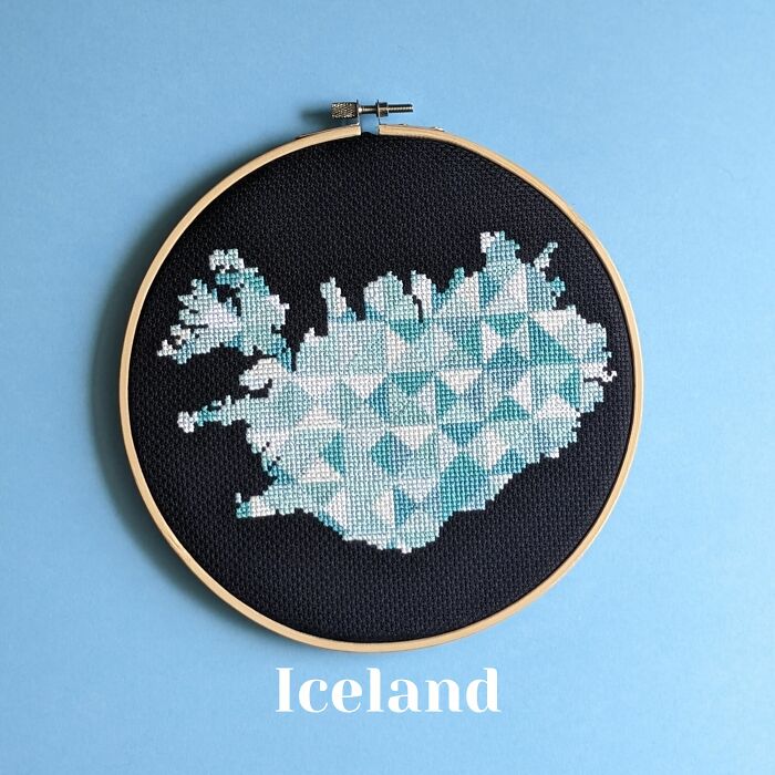 Iceland’s map in crisp blues and whites, stitched on black fabric and framed in a wooden hoop.