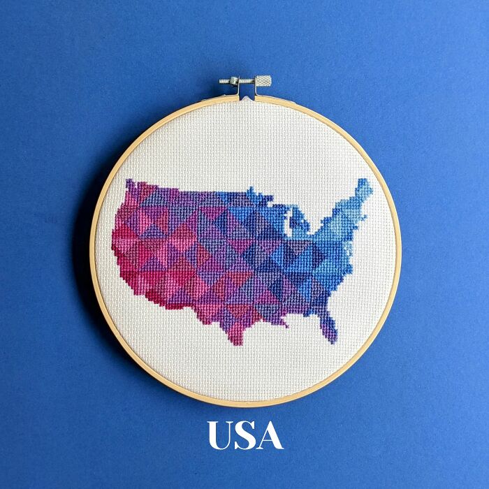 USA’s map in bold blues and purples with geometric patterns, framed in a hoop on a blue background.