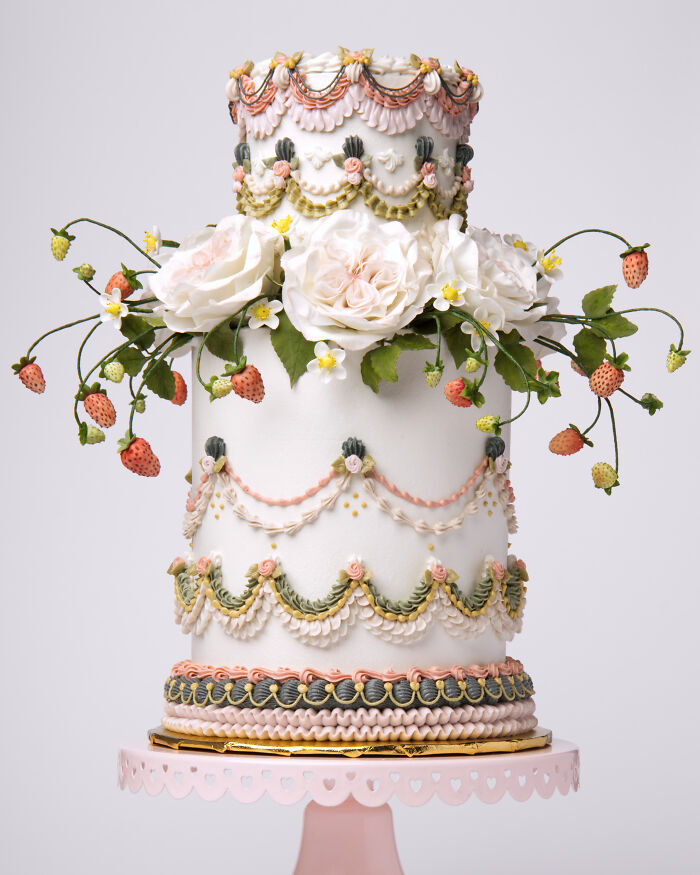 A charming vegan cake blooming with sculpted roses and juicy strawberries.